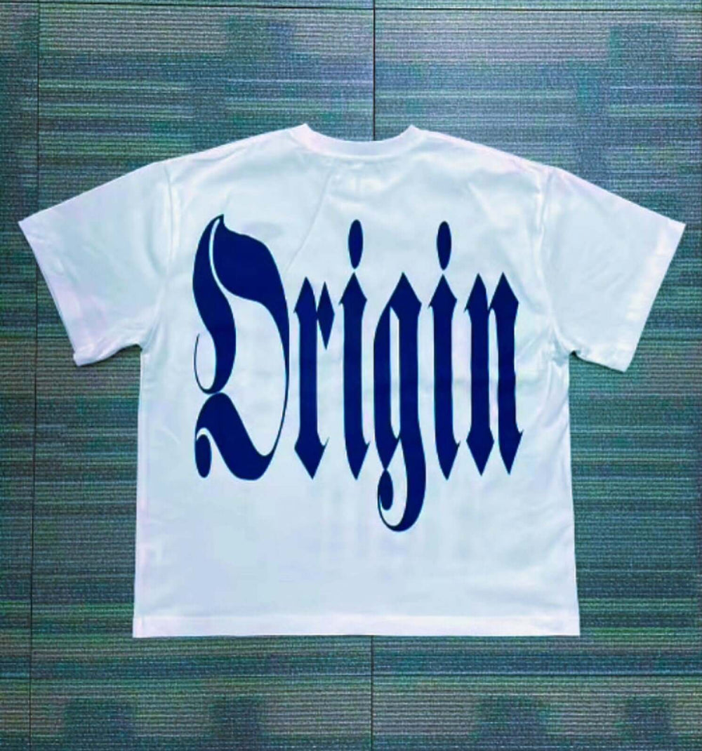 IBeorigin T-Shirt (Pre-Order) in white cotton with bold navy 'Origin' gothic text on the back, blending streetwear with cultural identity.