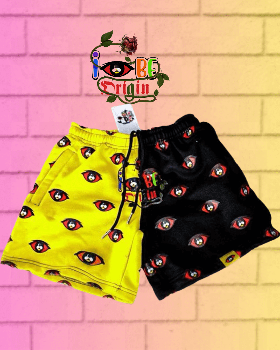 Fleece Bright Shorts in yellow and black with eye pattern, zipper pockets, and drawstring waist. 